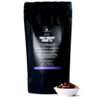 August Mojave - Smoky Hibiscus Cherry Tea (Very Low Caffeine) in a tea bag, featuring a vibrant design, for brewing.