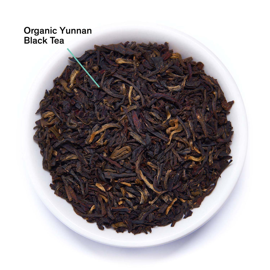 August Essentials Black Gold Black Tea loose tea leaves in an annotated display, showcasing the product's quality and detail.