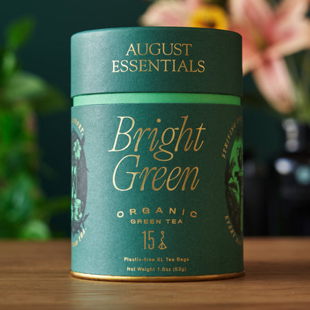 August Essentials Bright Green Green Tea - 15 Tea Bags, featuring organic kukicha green tea from Japan in a packaging image.