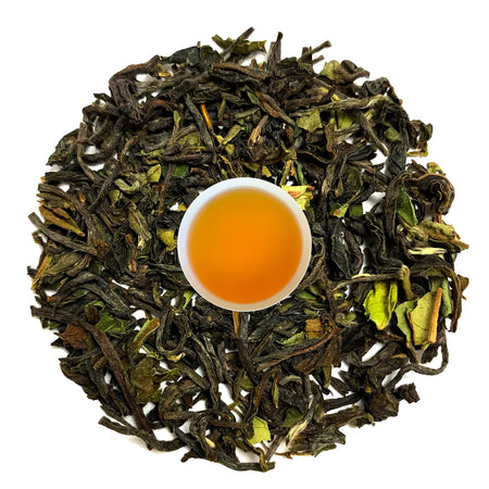 Danfe Ilam Loose Leaf Black Tea displayed with infused tea leaves and brewed liquor in a clear cup