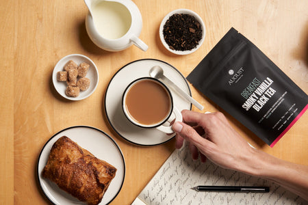 August Breakfast - Smoky Vanilla Black Tea in a cup, featuring tea bags, from the brand August