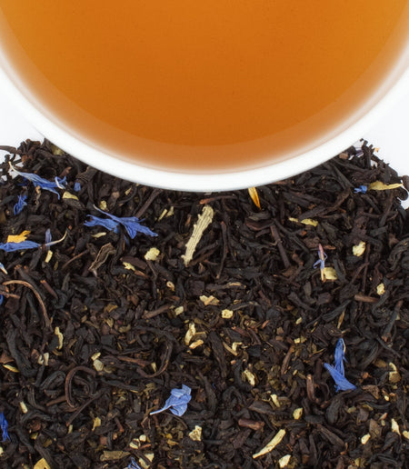Harney & Sons Caribe tea blend shown in a cup, featuring green and black teas with tropical fruit and floral flavors.