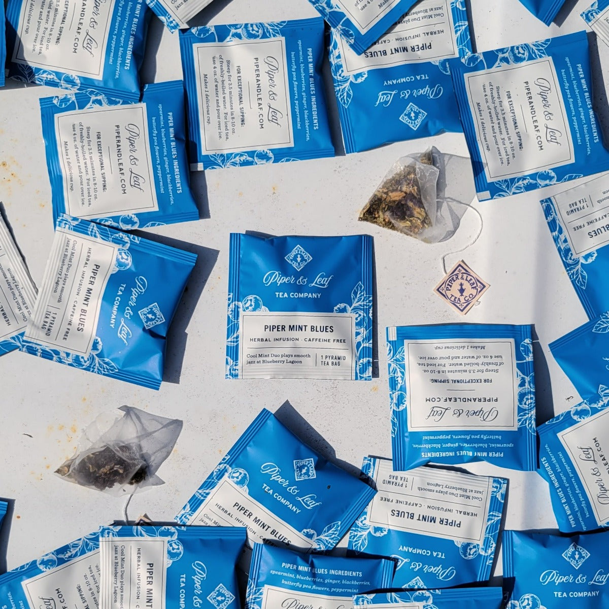 Piper and Leaf Piper Mint Blues Case of Individually Wrapped Tea Bags- 50ct, featuring tea sachets with mint and berry notes.