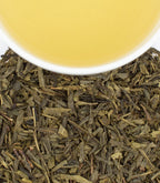 Harney & Sons Organic Supreme Green, HT Tin of 20 Sachets, displayed with a cup showcasing the tea