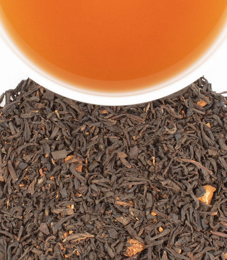 Harney & Sons Apple Cinnamon black tea blend in a cup, showcasing its rich aroma and warm cinnamon notes.