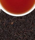 Harney & Sons Strawberry Vanilla, HT Tin of 20 Sachets, shown in a cup with brewed tea and sachets displayed.