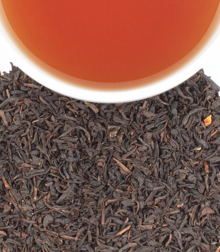 Harney & Sons Cranberry Autumn black tea in a cup, featuring flavors of cranberry and orange, ideal for autumn enjoyment.