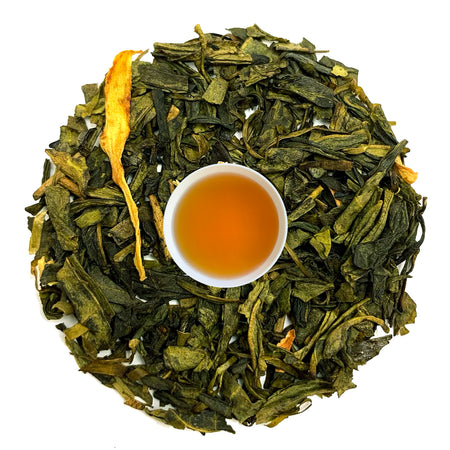 Danfe Nepal Jasmine Green Tea in loose leaf form, showcasing tea leaves with brewed liquor in a clear glass.