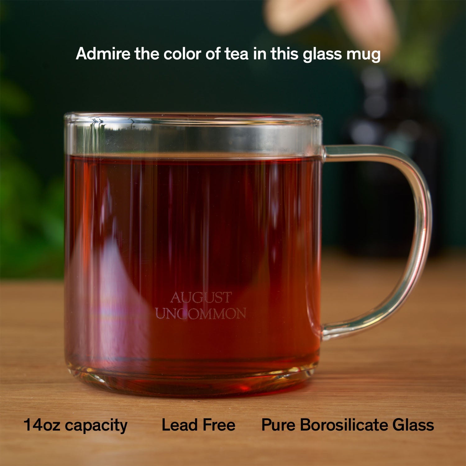 August Glass Mug - Clear Elegance by August, a 14-ounce heat-resistant borosilicate glass mug showcasing vibrant tea hues.