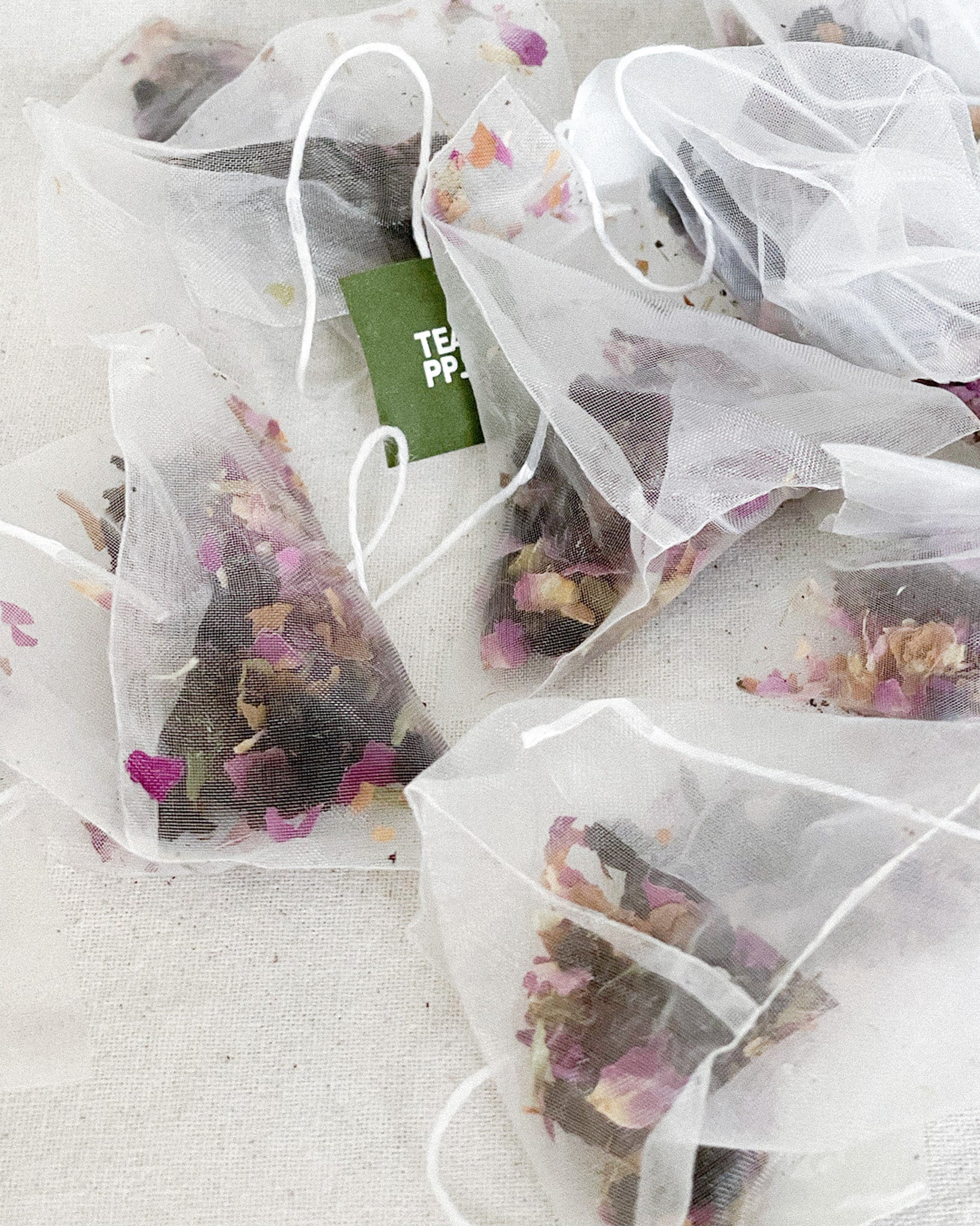 Teappo Rose Oolong tea leaves displayed in a clear packaging, showcasing their color and texture