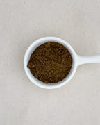 Teappo Organic Hojicha Powder in a package, showcasing its earthy brown color and fine texture