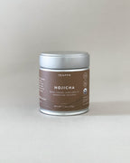 Teappo Organic Hojicha Powder in a tea tin, 1.4 oz (40g), showcasing its nutty, creamy flavor profile, ideal for lattes.