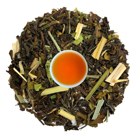 Loose leaf Danfe Nepal Lemongrass Ilam Black Tea displayed alongside brewed tea in a cup, highlighting its herbal and floral notes.