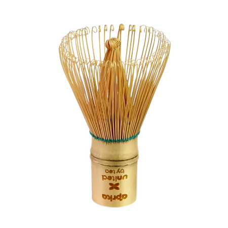 Aprika Life Bamboo Matcha Whisk (100 Prongs) made of golden bamboo, designed for making matcha beverages.