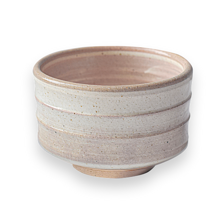 Aprika Life Beige Ceramic Matcha Bowl, handcrafted Japanese pottery, showcasing unique design and ergonomic shape for matcha preparation.