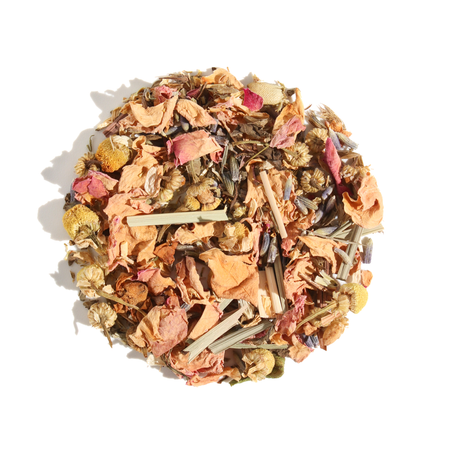 Plum Deluxe Calm Chamomile Bloom Herbal Tea (Rose - Lavender) in a circular package, featuring chamomile, rose, and lavender ingredients.