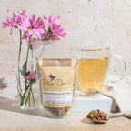 Plum Deluxe Calm Chamomile Bloom Herbal Tea (Rose - Lavender) in a lifestyle setting, showcasing the tea packaging and ambiance.
