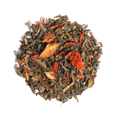Plum Deluxe Candied Orange Green Tea in a circular tin, featuring a blend of green tea and candied orange notes.
