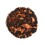 Plum Deluxe Caramel Almond Black Tea in a circular packaging, showcasing its blend of black tea, apple, cinnamon, and almond.