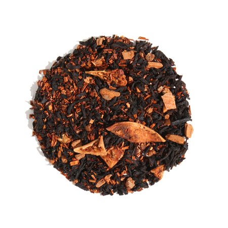 Plum Deluxe Caramel Almond Black Tea in a circular packaging, showcasing its blend of black tea, apple, cinnamon, and almond.