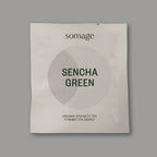 Sencha Green Pyramid Sachet (individually wrapped) by Somage USA, showing 50 sachets of organic green tea from Zhejiang, China.