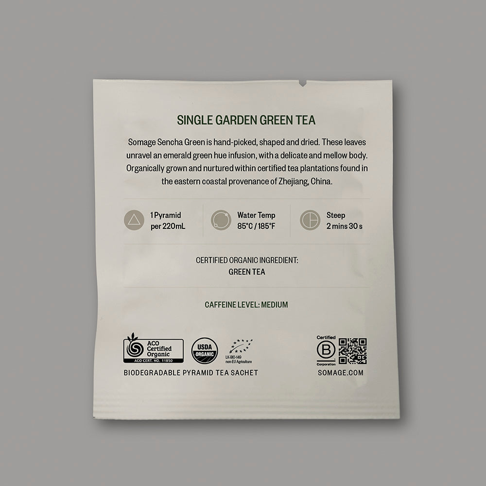 Sencha Green Pyramid Sachet (individually wrapped) by Somage USA, showing a green tea sachet in a pyramid shape.