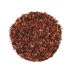 Plum Deluxe Chocolate Hazelnut Dessert Tea in a circular tea blend display, featuring honeybush, cocoa nibs, and natural flavors.