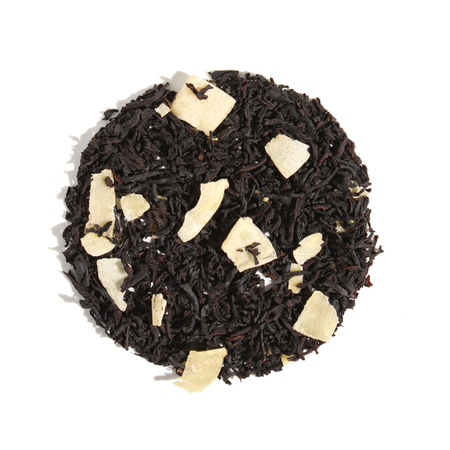 Plum Deluxe Coconut A La Creme Black Tea, a blend of black tea, coconut pieces, and natural flavors, shown in a circular package.