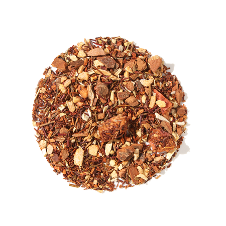 Plum Deluxe Coconut Ginger Soother Herbal Tea in a circular packaging, featuring coconut, ginger, apple, and cinnamon ingredients.