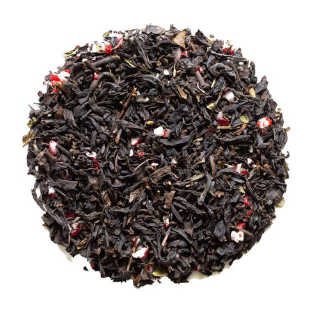 Beach House Peppermint Frost tea leaves with candy cane pieces, showcasing a blend for the holiday season in a soothing presentation.