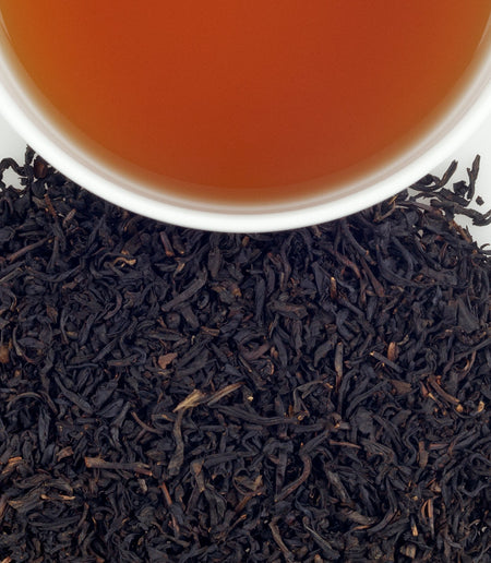 Harney & Sons Passion Fruit tea in a cup, showcasing the vibrant infusion of black tea and fruity passion fruit notes.