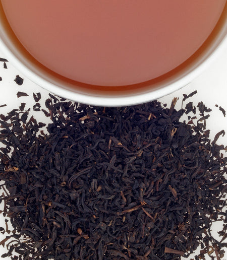 Cup of Harney & Sons Boston Tea, featuring black tea with cranberry and almond notes, set against a simple background.