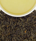 Harney & Sons Citron Green, Classic Tin of 20 Sachets, displayed in a cup with tea, showcasing the packaging design.