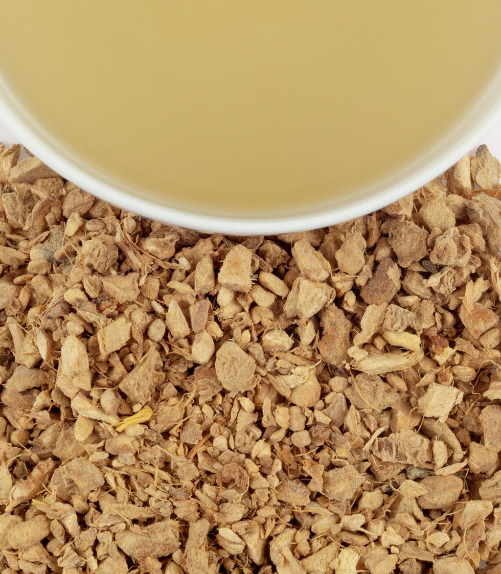 Harney & Sons Organic Ginger Lemon, HT Tin of 20 Sachets, displayed in a cup with tea infusion visible.