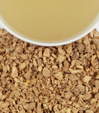 Harney & Sons Organic Ginger Lemon, HT Tin of 20 Sachets, displayed in a cup with tea infusion visible.