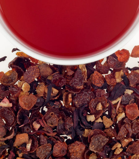 Harney & Sons Goji Berry Fruit Tea in a cup, showcasing its vibrant ruby hue and caffeine-free herbal infusion.