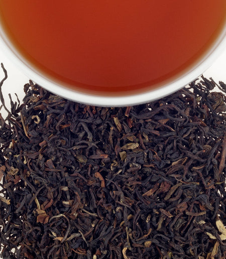 Harney & Sons Indian Nimbu tea in a cup, featuring a lemon and caramel blend from high-quality Darjeeling tea.