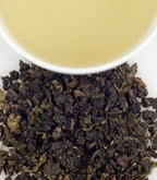 Harney & Sons Milky Oolong, Tin of 20 Sachets with a cup showing brewed tea, by Harney & Sons