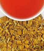 Harney & Sons Organic Ginger Turmeric, HT Tin of 20 Sachets displayed in a cup with herbal tea