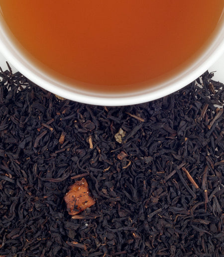 Harney & Sons Peaches & Ginger tea in a cup, showcasing the blend of peaches and ginger flavors