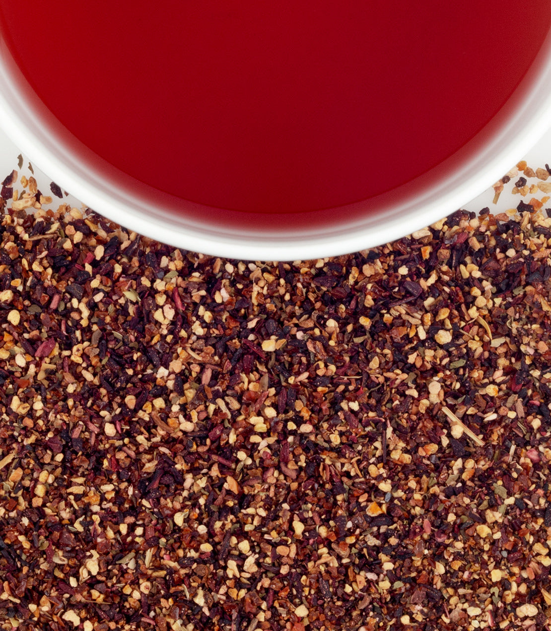 Harney & Sons Raspberry Herbal, HT Tin of 20 Sachets displayed in a cup, featuring raspberry tea infusion.