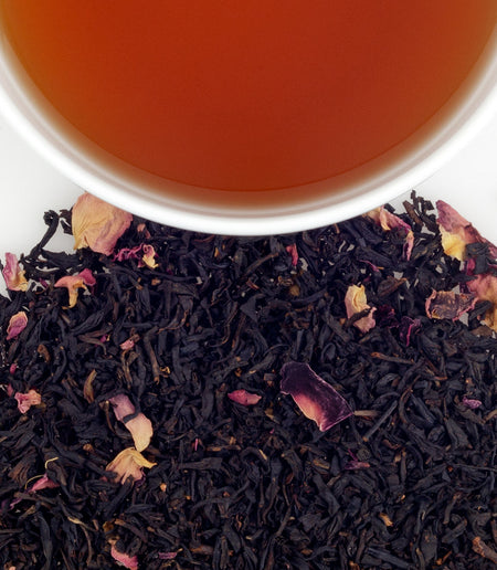 Harney & Sons Rose Scented tea displayed in a cup, featuring rosebuds and petals in the blend for visual appeal.