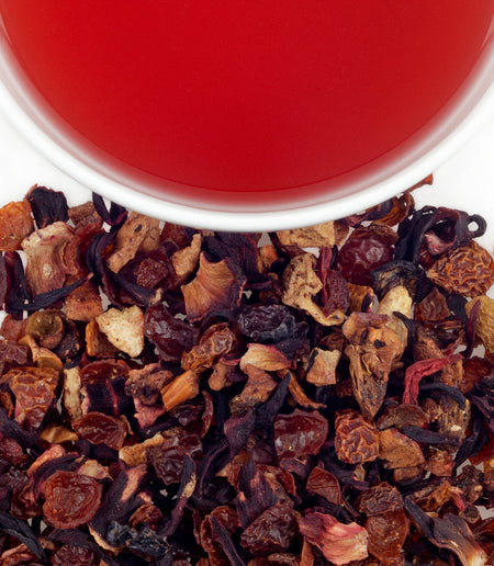 Harney & Sons Strawberry Kiwi Fruit Tea displayed in a cup, showcasing its vibrant ruby-red color and herbal infusion.