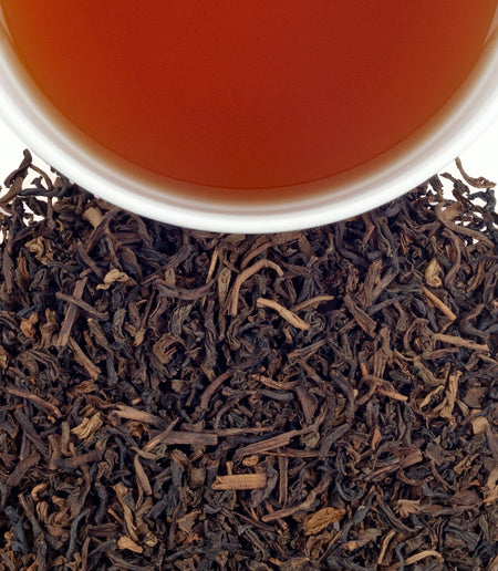 Harney & Sons Decaf Vanilla Comoro tea displayed in a cup, showcasing its rich, aromatic vanilla color and texture.