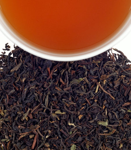 Harney & Sons Viennese Earl Grey tea displayed in a cup, showcasing its light Darjeeling base and citrusy bergamot notes.