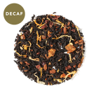 Plum Deluxe No Obligations Decaf Black Tea (Hazelnut - Almond - Cinnamon) in a circular package, showcasing its natural ingredients.