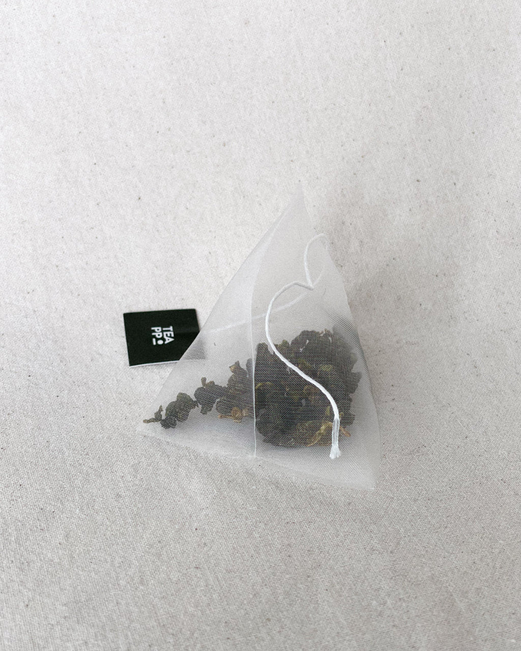 Teappo Four Springs tea product displayed in a clear packaging with a vibrant design, by vendor Teappo.
