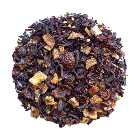 Beach House Warm Springs Frost tea leaves in an infuser, showcasing organic hibiscus, rose hips, cloves, orange peel, and bee pollen.