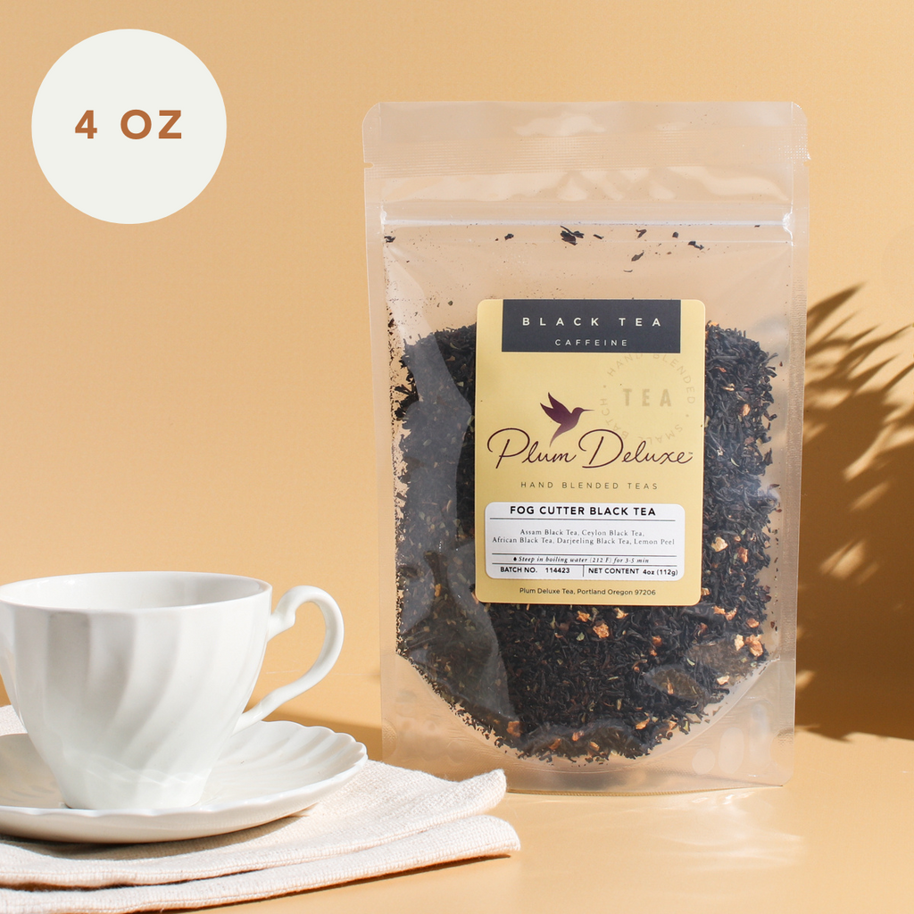 Plum Deluxe Fog Cutter Black Tea (Irish Breakfast w-Hint of Lemon) in a 4 oz package, featuring a vibrant tea blend.