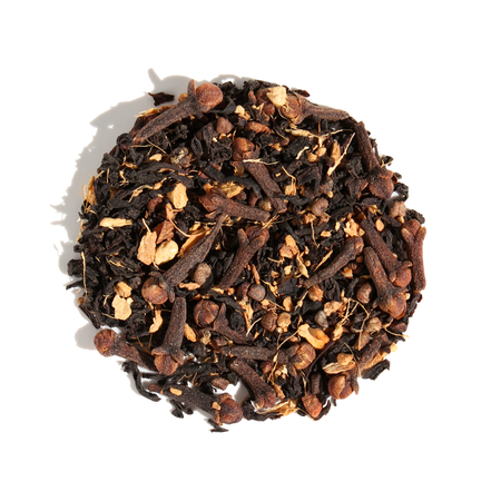 Plum Deluxe Full Moon Chai (Vanilla Butternut Masala Chai) in a circular package, showcasing its unique blend and ingredients.